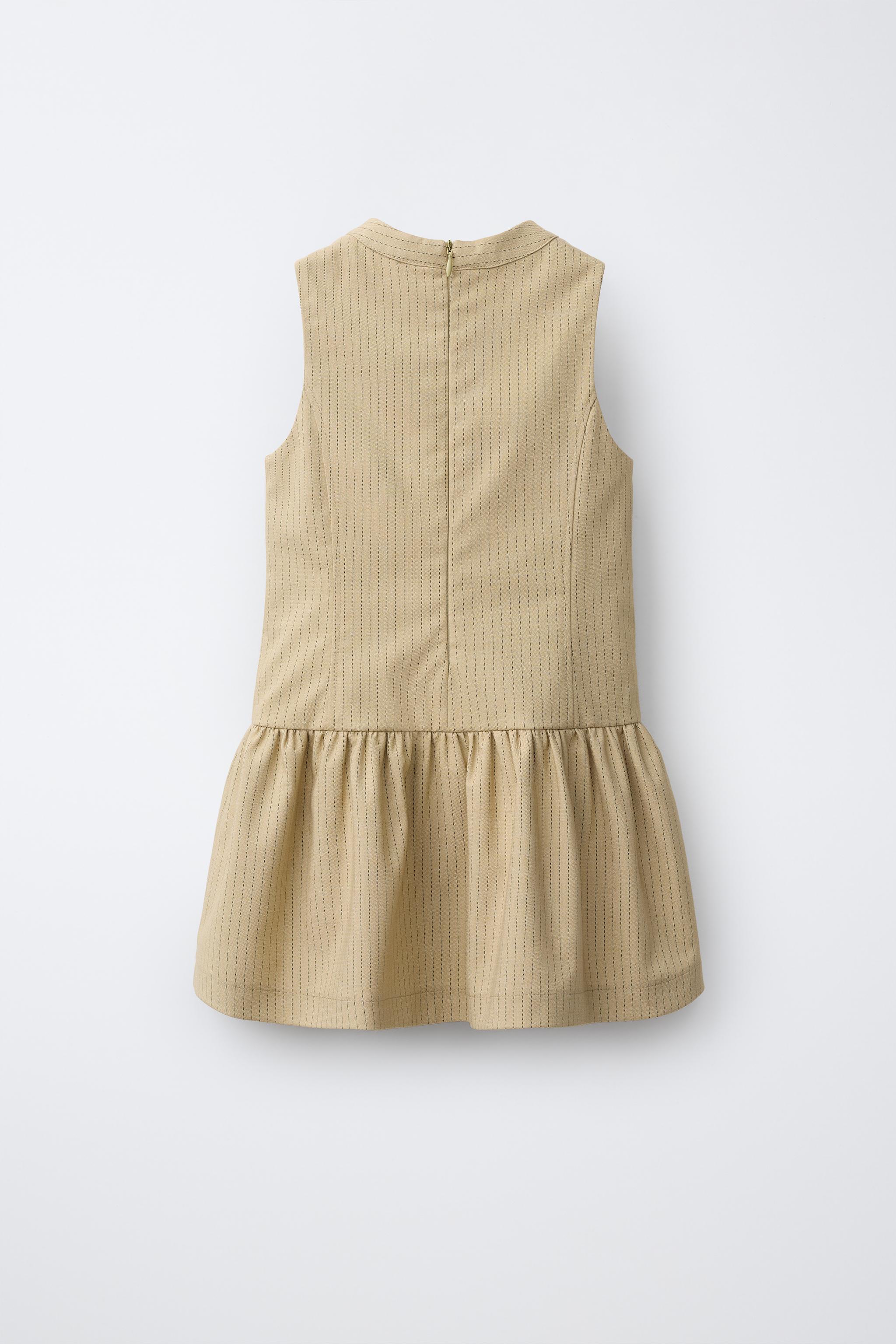 STRIPED DRESS WITH FROG FASTENINGS